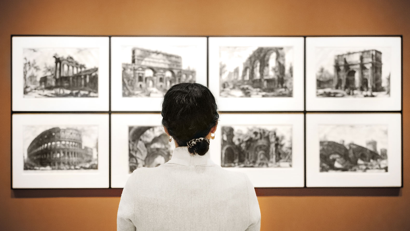 woman looking at art